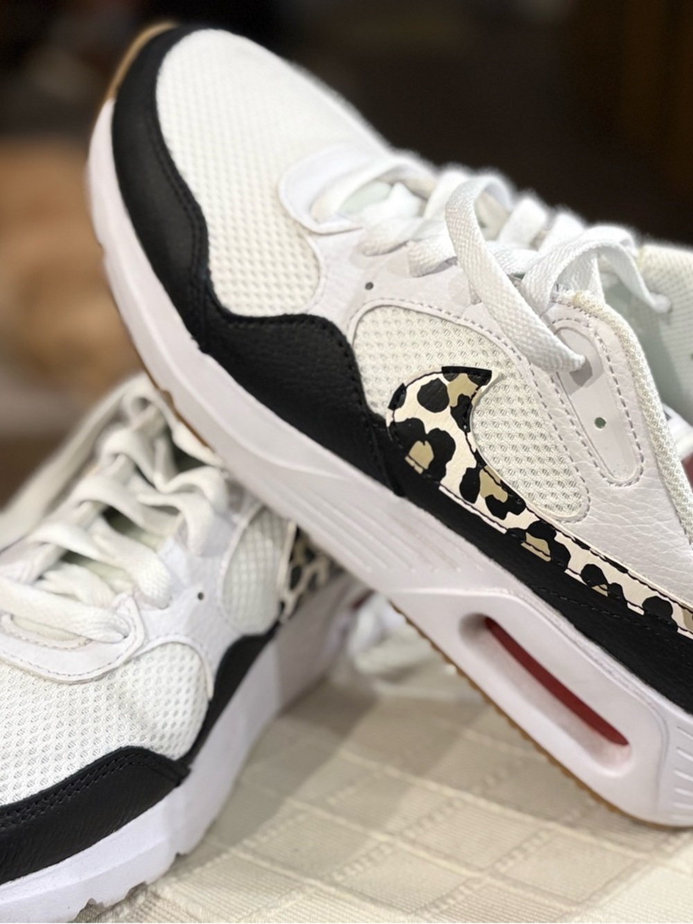 Nike Women's White and Black Sneakers with Leopard Swoosh